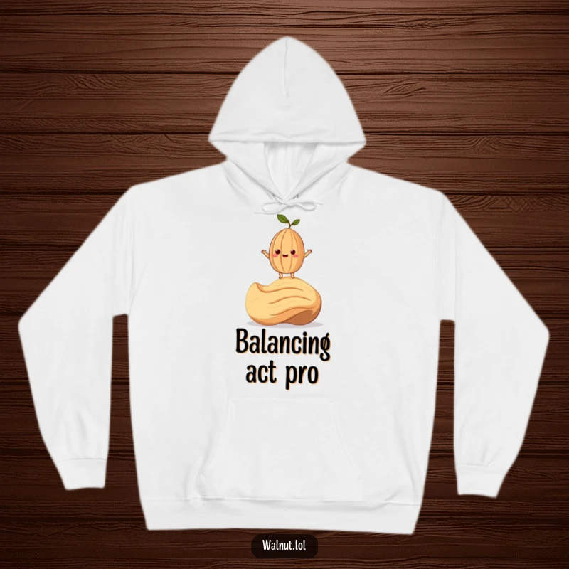 Funny Hoodie featuring a smiling walnut character precariously balanced on a giant cashew, perfect for cozy humor.