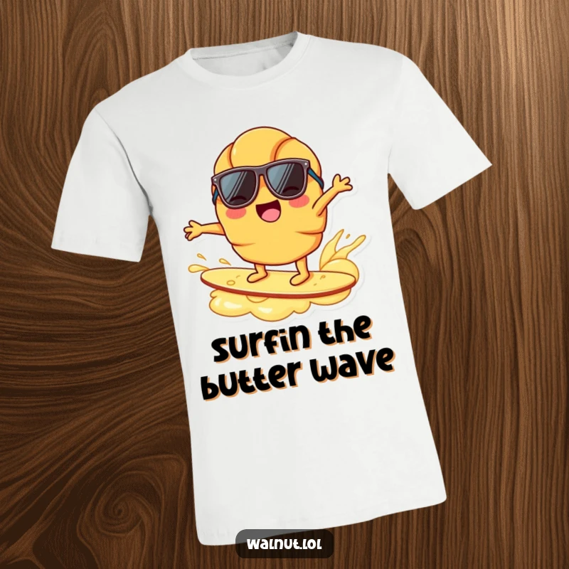 Funny joyful croissant character, sunglasses, surfing on butter ripple, breakfast humor, beach vibe, cool pastry tee.